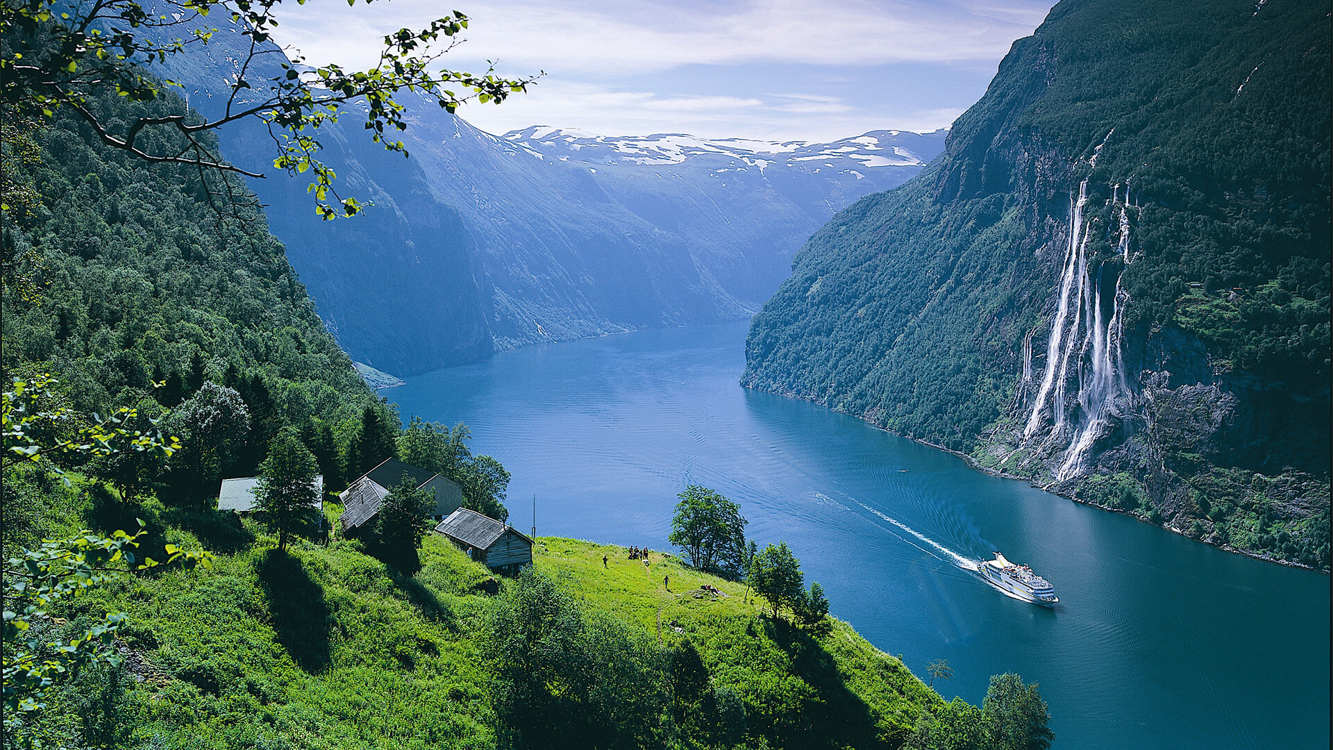 A cruise ship sailing in a beautiful fjord in Norway