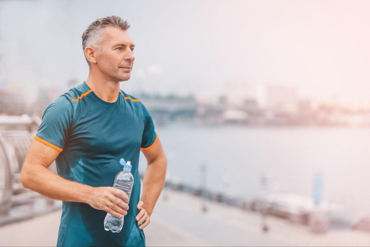 metabolic health: man holding a water bottle