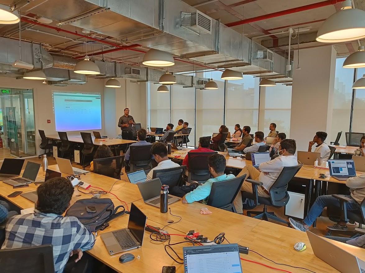 A picture of staff coming together to work in Pune, India.