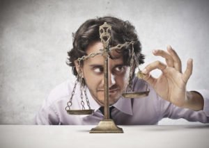 Business Man Tries To Balance His Money
