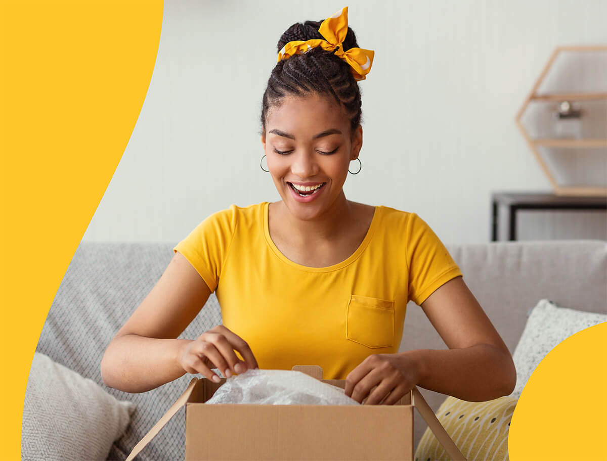 Woman excitedly opening a package