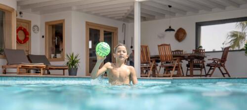 How can I help my child to learn to swim?