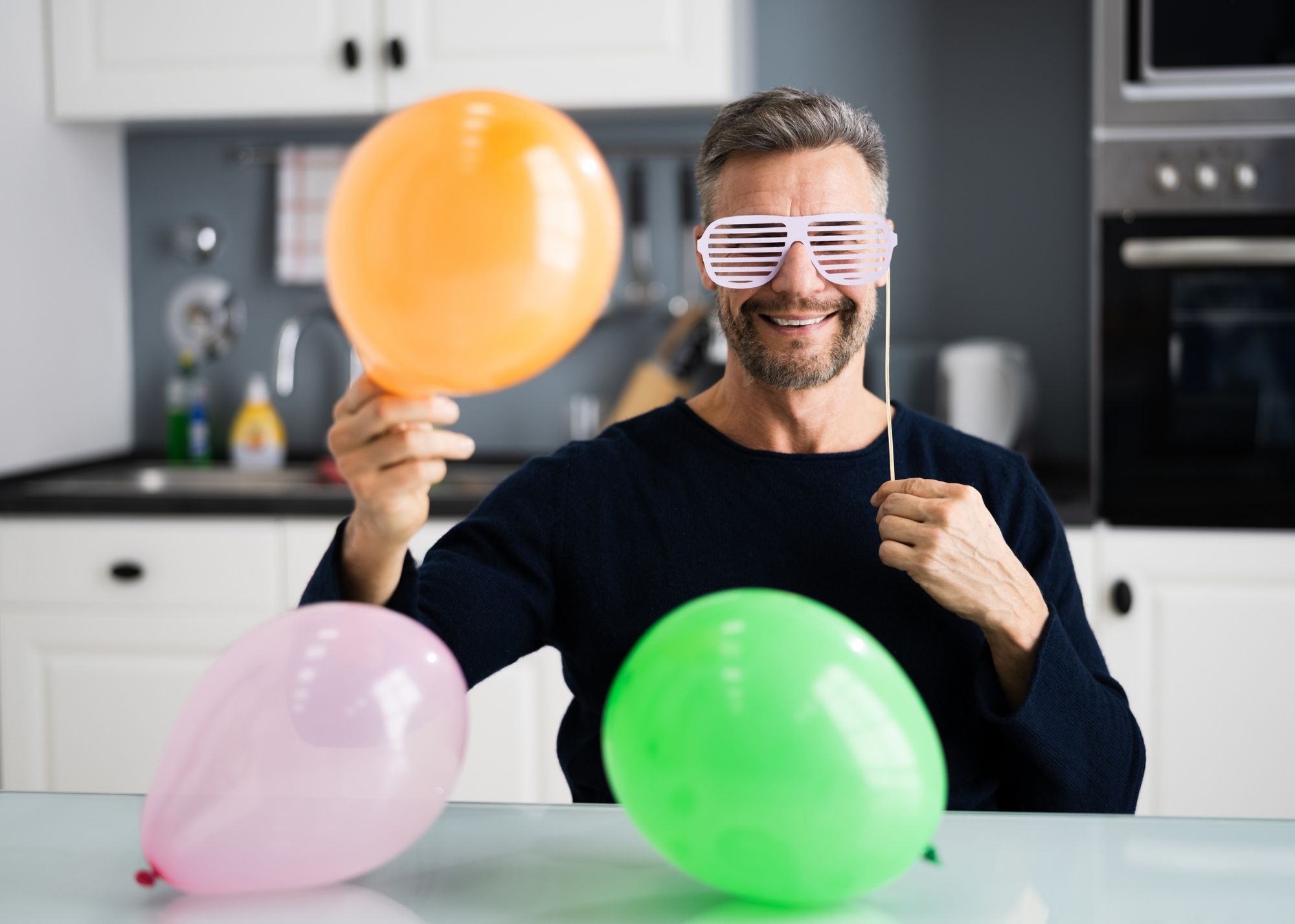 man with fun birthday props