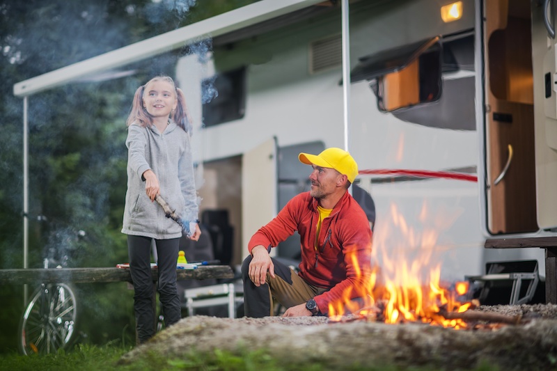 South Dakota RV family around fire