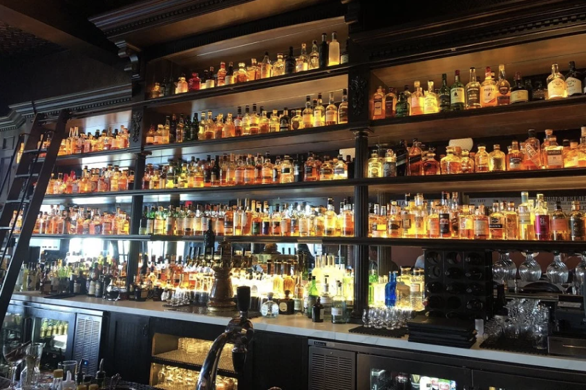 When I typed the words “swanky cocktail bar” above, Proof is exactly what I pictured. This prohibition-style lounge features more than 300 premium whiskeys (if that’s your thing), and a large variety of wines, brews, and cocktails. I pulled my classic “can you make me something fruity but not very sweet,” and the bartender definitely delivered!
