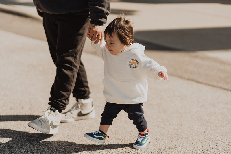 cute baby walking outside of omaha christian church