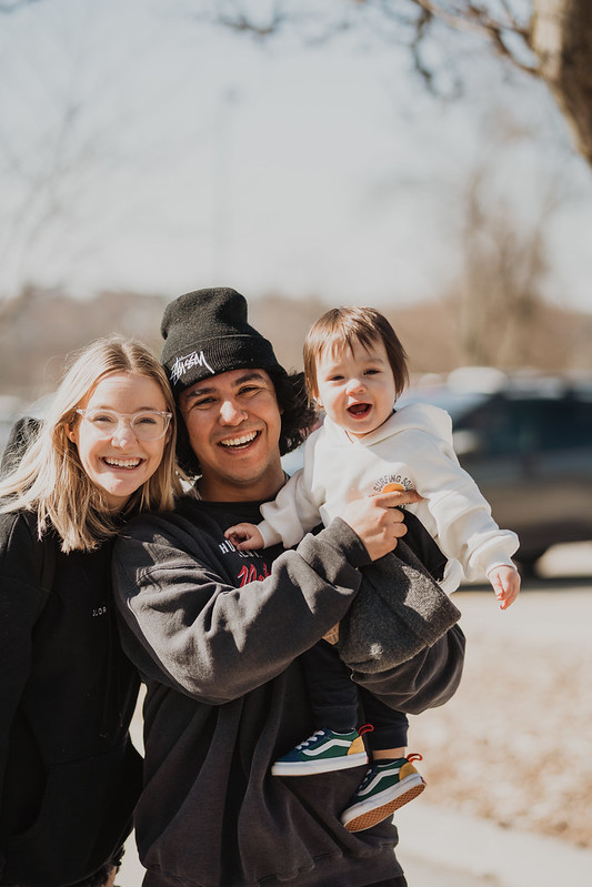 family smiling outside of omaha church in omaha nebraska