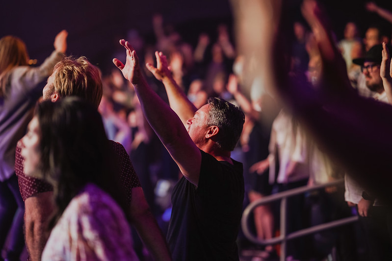 man woshipping at church in omaha nebraska
