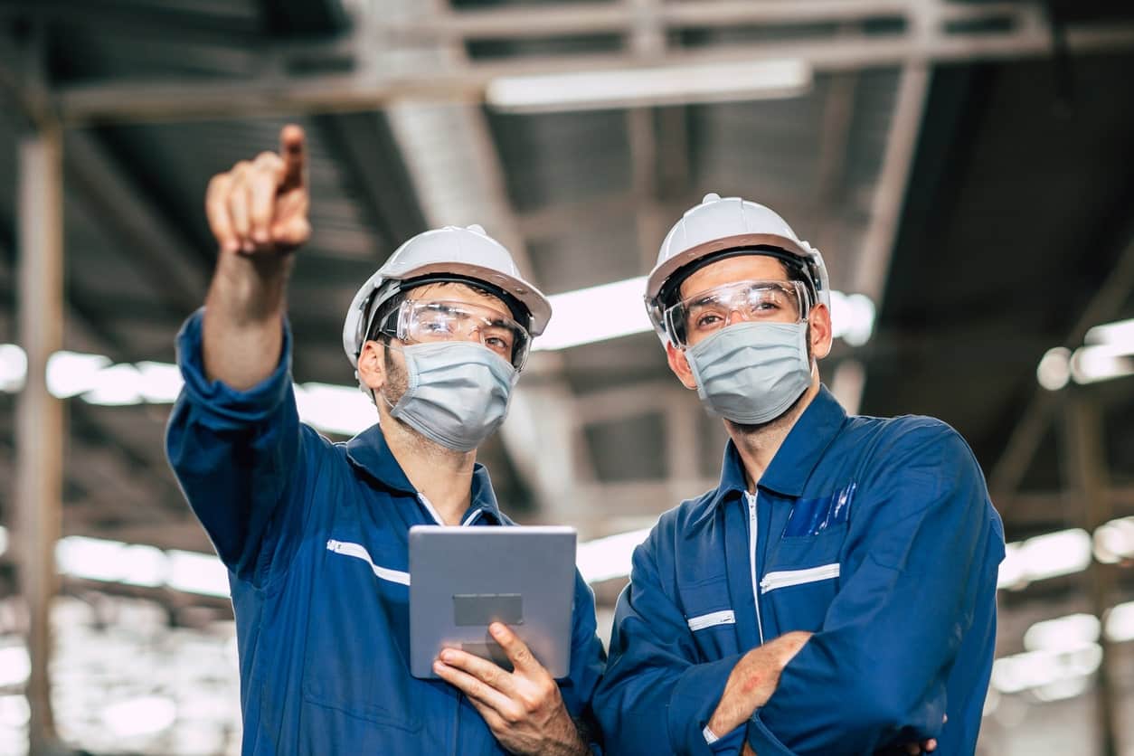 Construction workers wearing masks