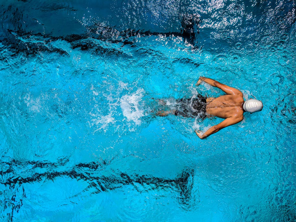 Free Person Swimming on Body of Water Stock Photo
