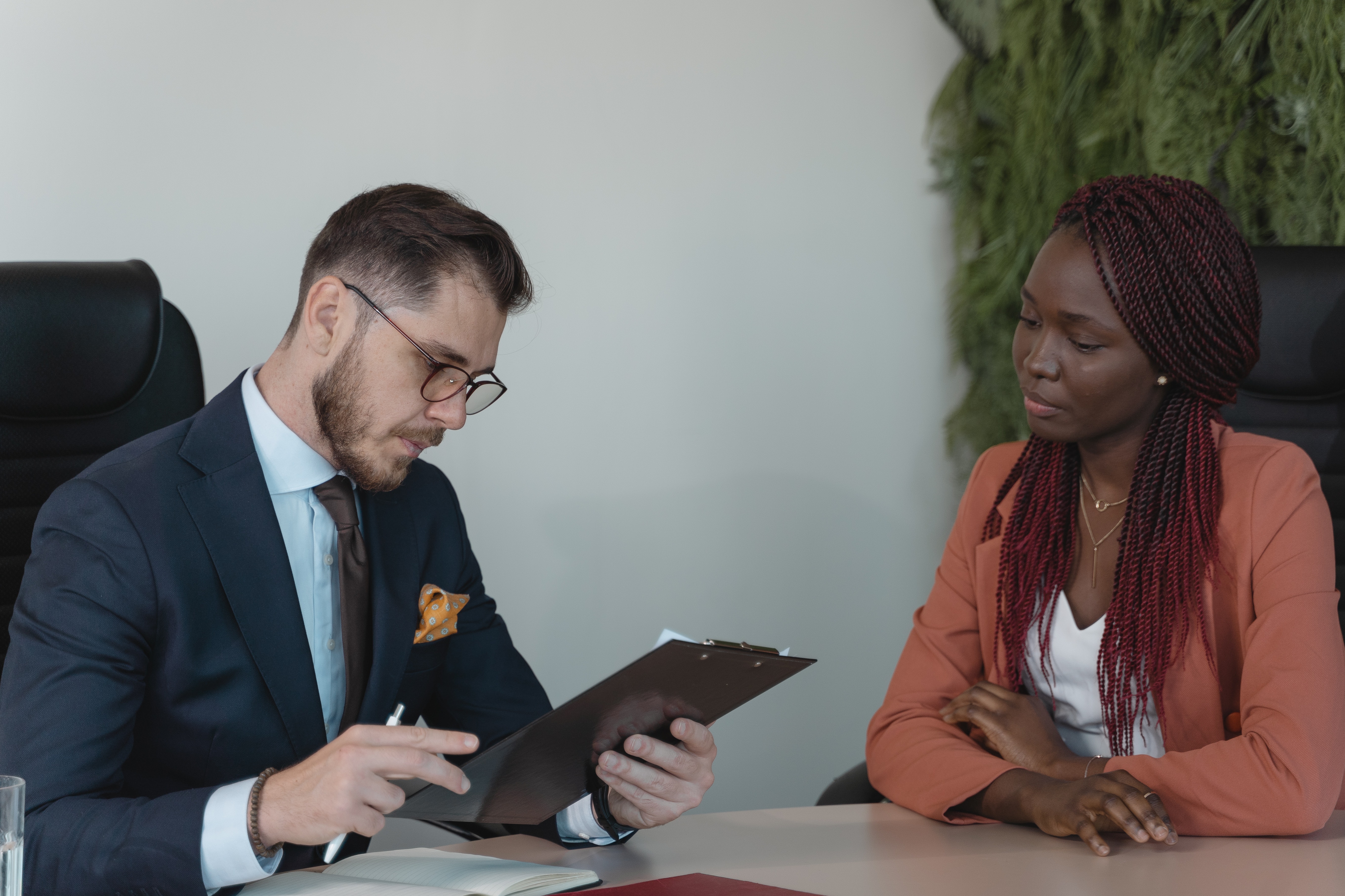An employee and a boss working together