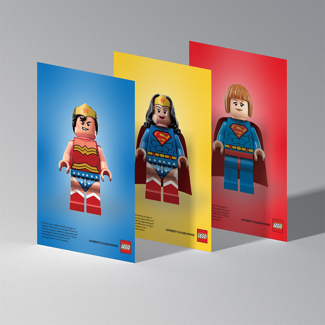 Three Lego print advertisements, each on a blue, red or yellow background with a Lego character depicting a gender non-specific super-hero. The tagline reads "Diversity is Power"
