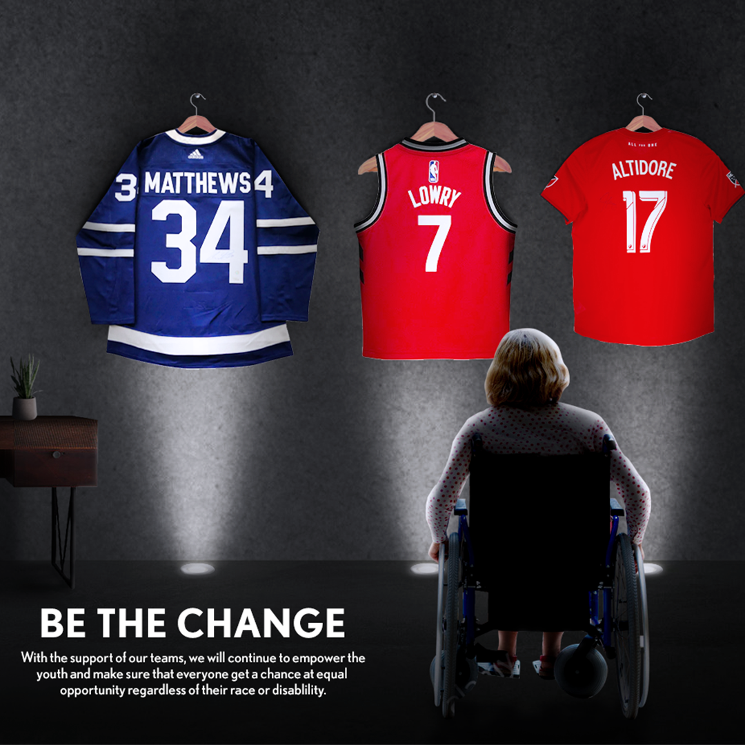 An advertisement with an image of a young man in a wheelchair seen from behind looking up at three sports jerseys hanging on hooks.Hockey, basketball and baseball. The text reads "Be the Change" "With the support of our teams, we will continue to empower the youth."