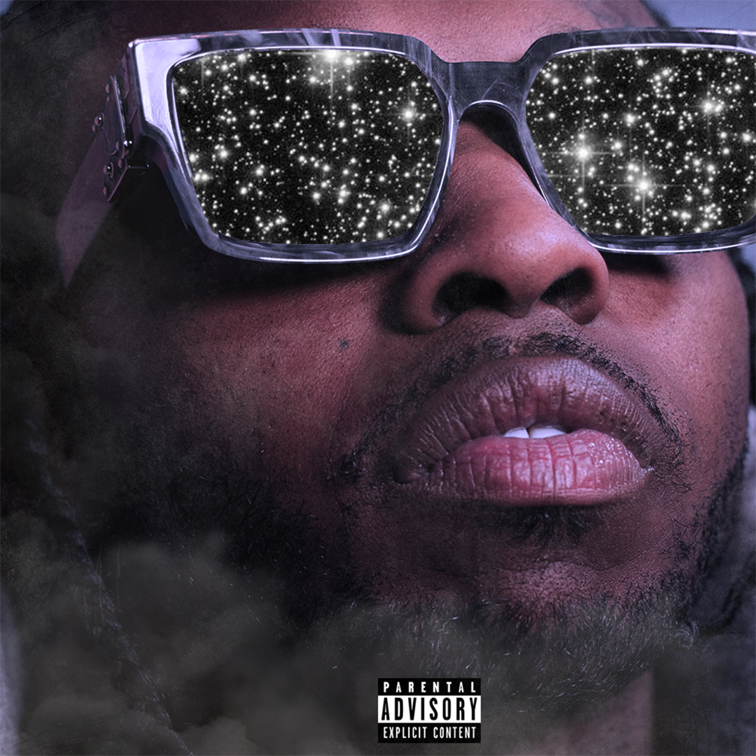 An African-Amercian male looking up wearing mirrored sunglasses reflect the stars in the sky.