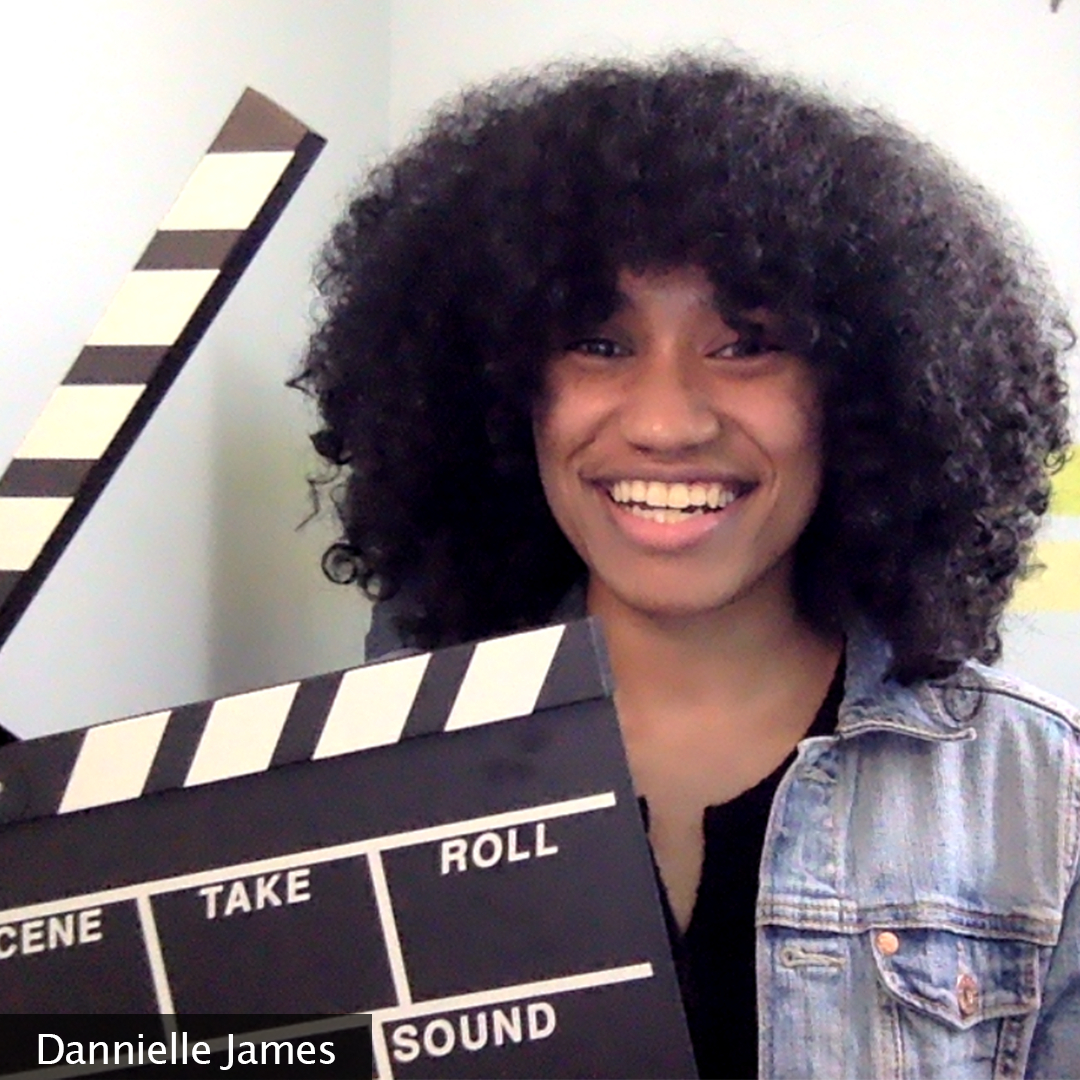 Picture of the creator smiling and holding a clapperboard. The creator's name, Dannielle James, is located in the bottom left corner of the image.