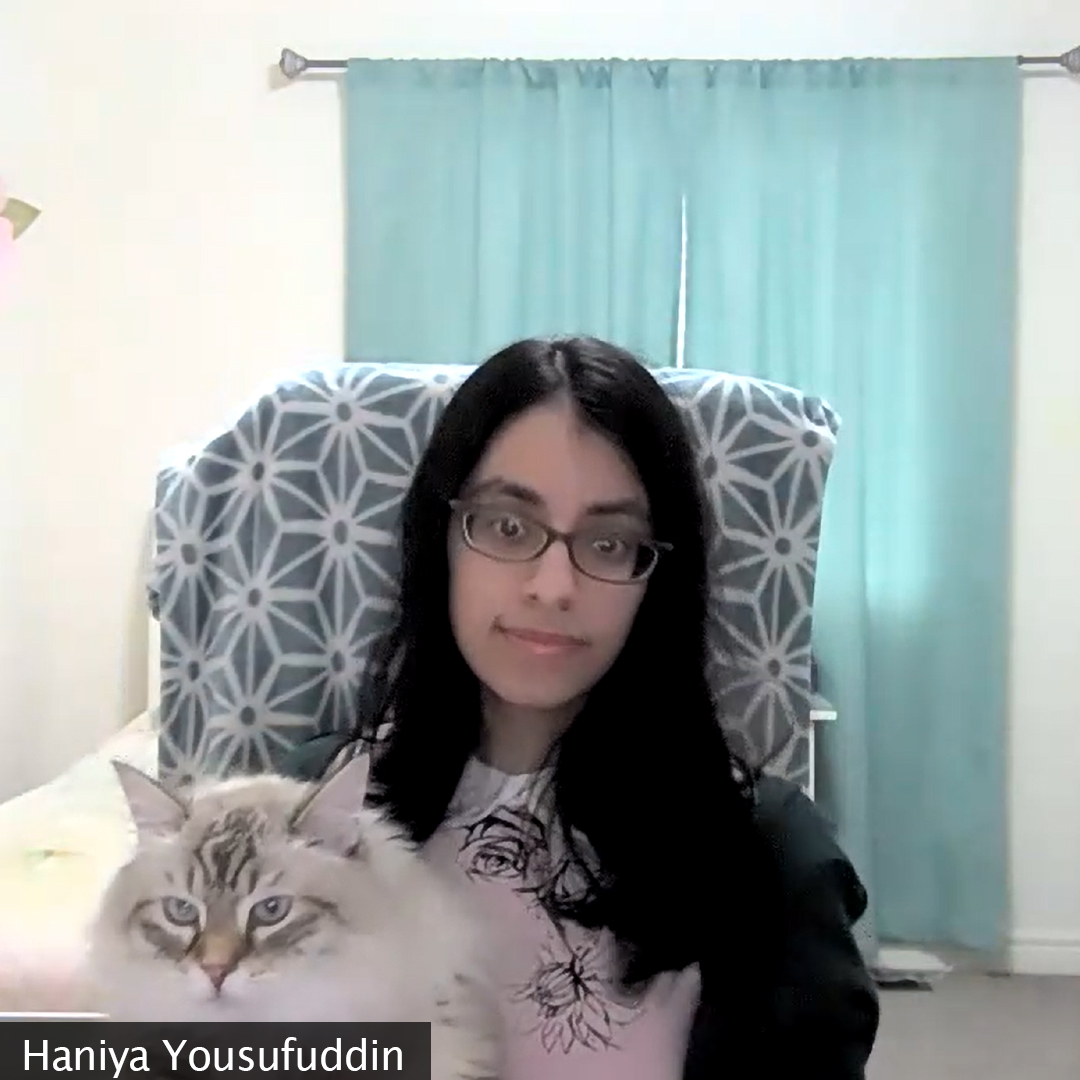 Picture of a girl sitting who is holding her cat, Leo