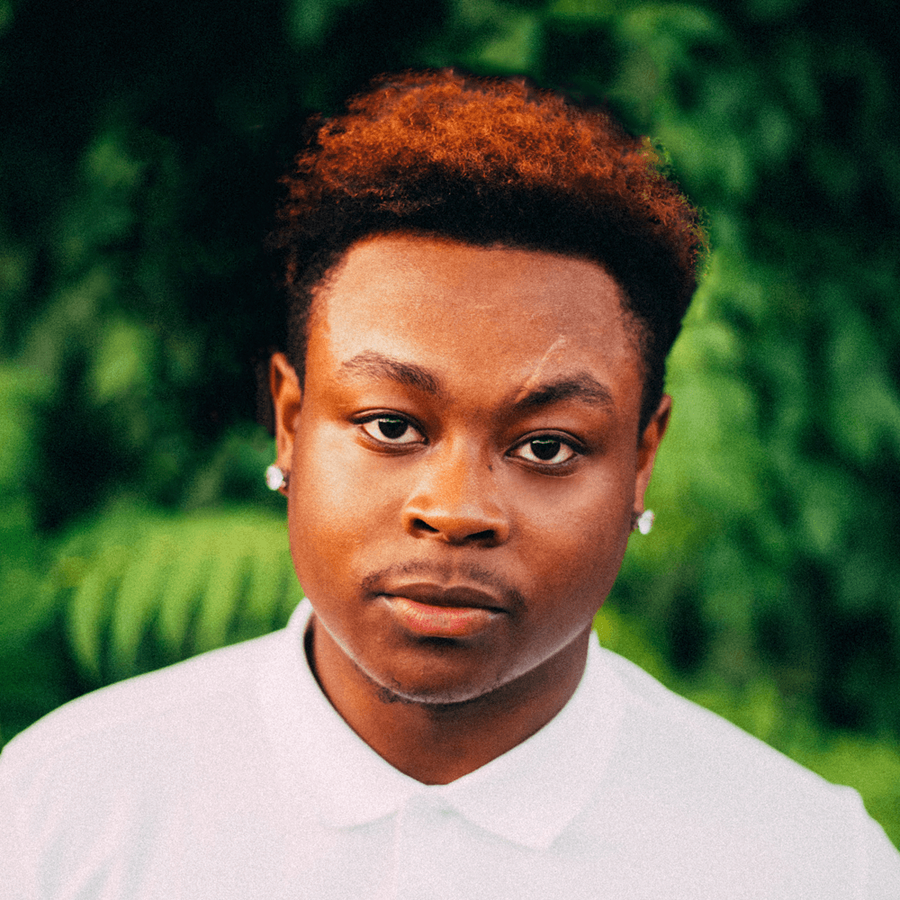 Picture of Dauntye outdoors, wearing a white shirt.