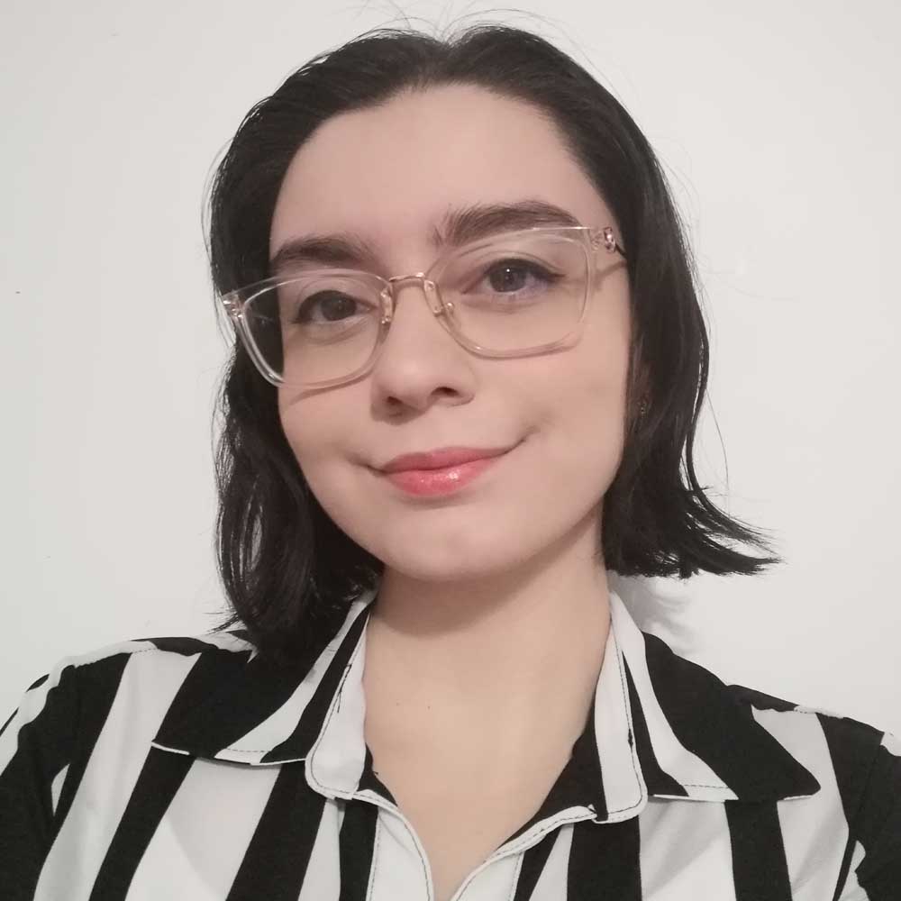 Picture of Farah, wearing a black and white shirt