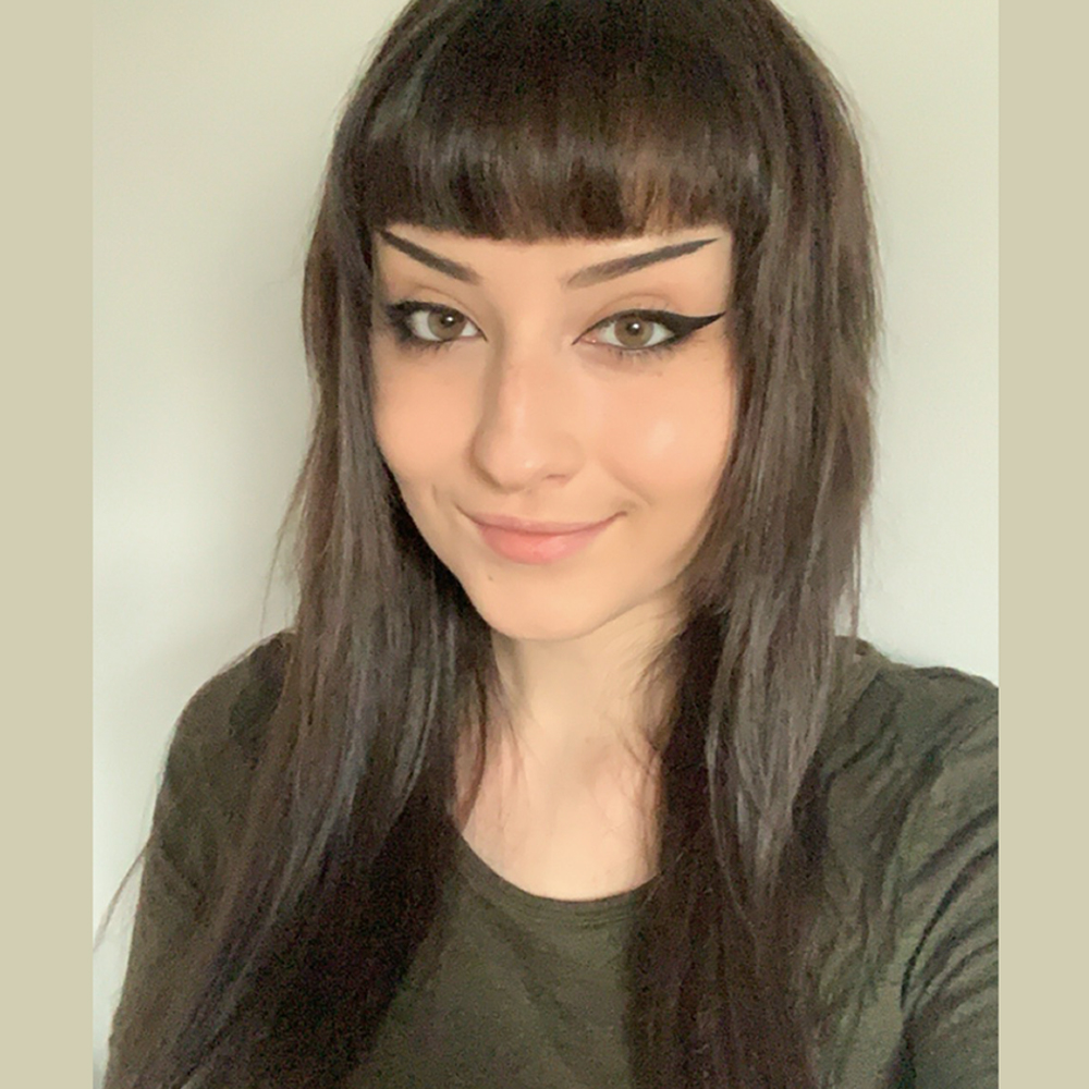 Picture of Victoria, wearing a dark green shirt