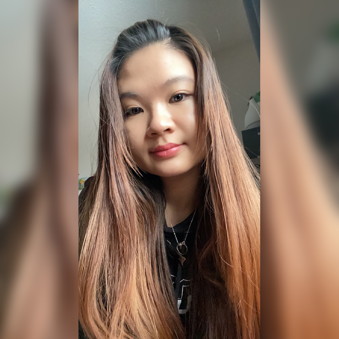 A headshot image of Nancy Ma. She is wearing a black sweater in front of a white wall.