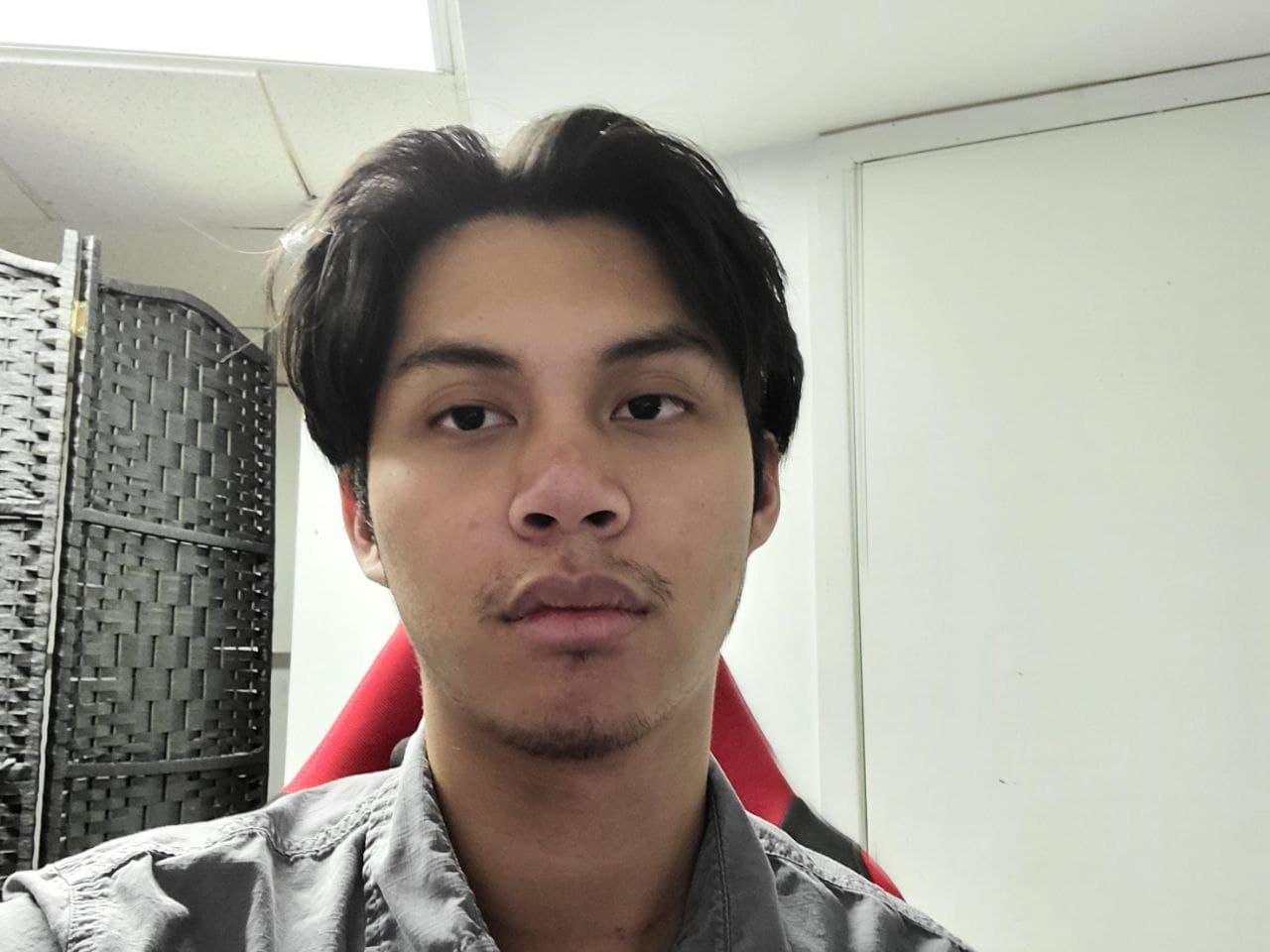Picture of Abram sitting in a red chair