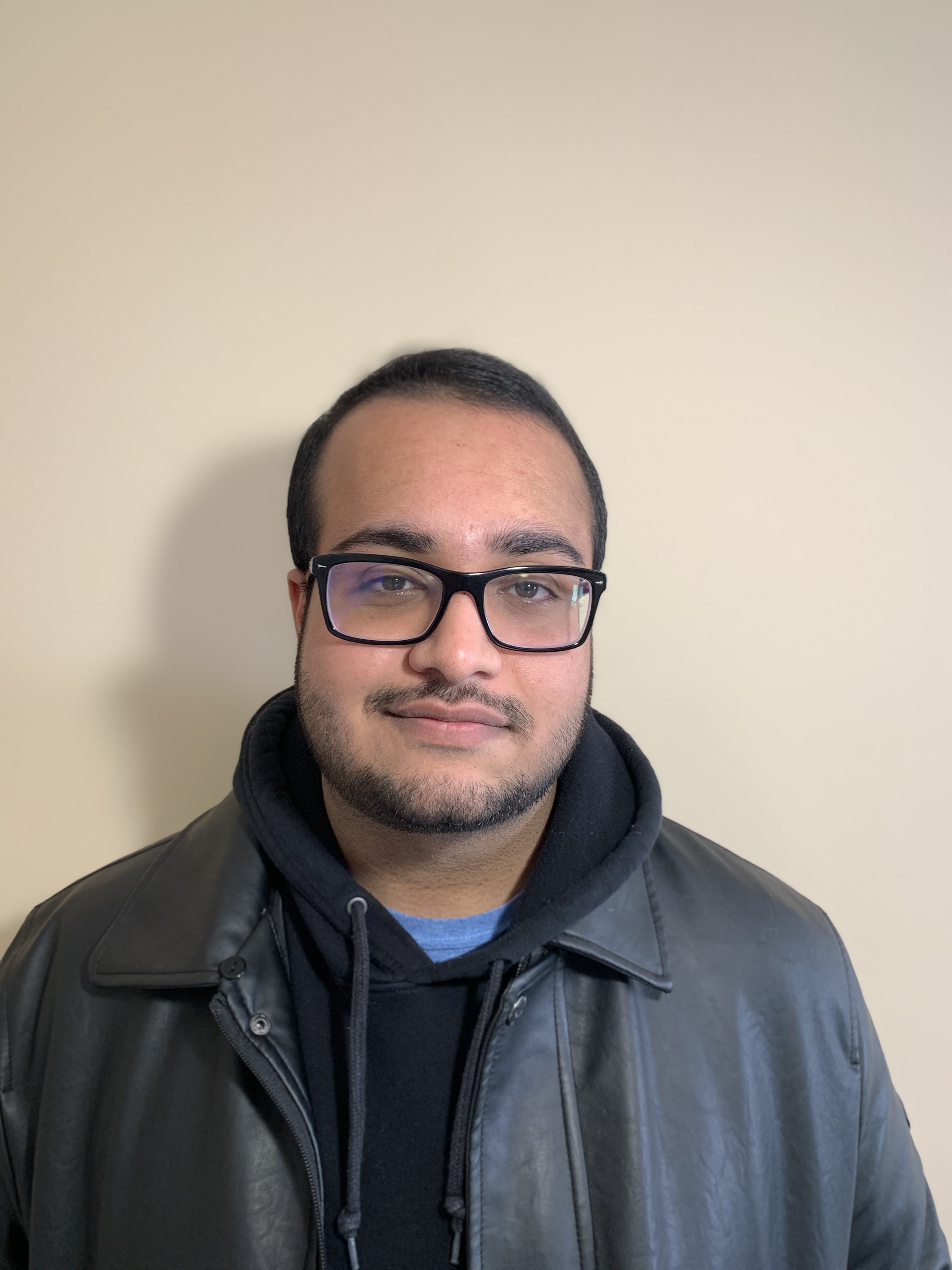 Picture of Hassaan, wearing a black leather jacket