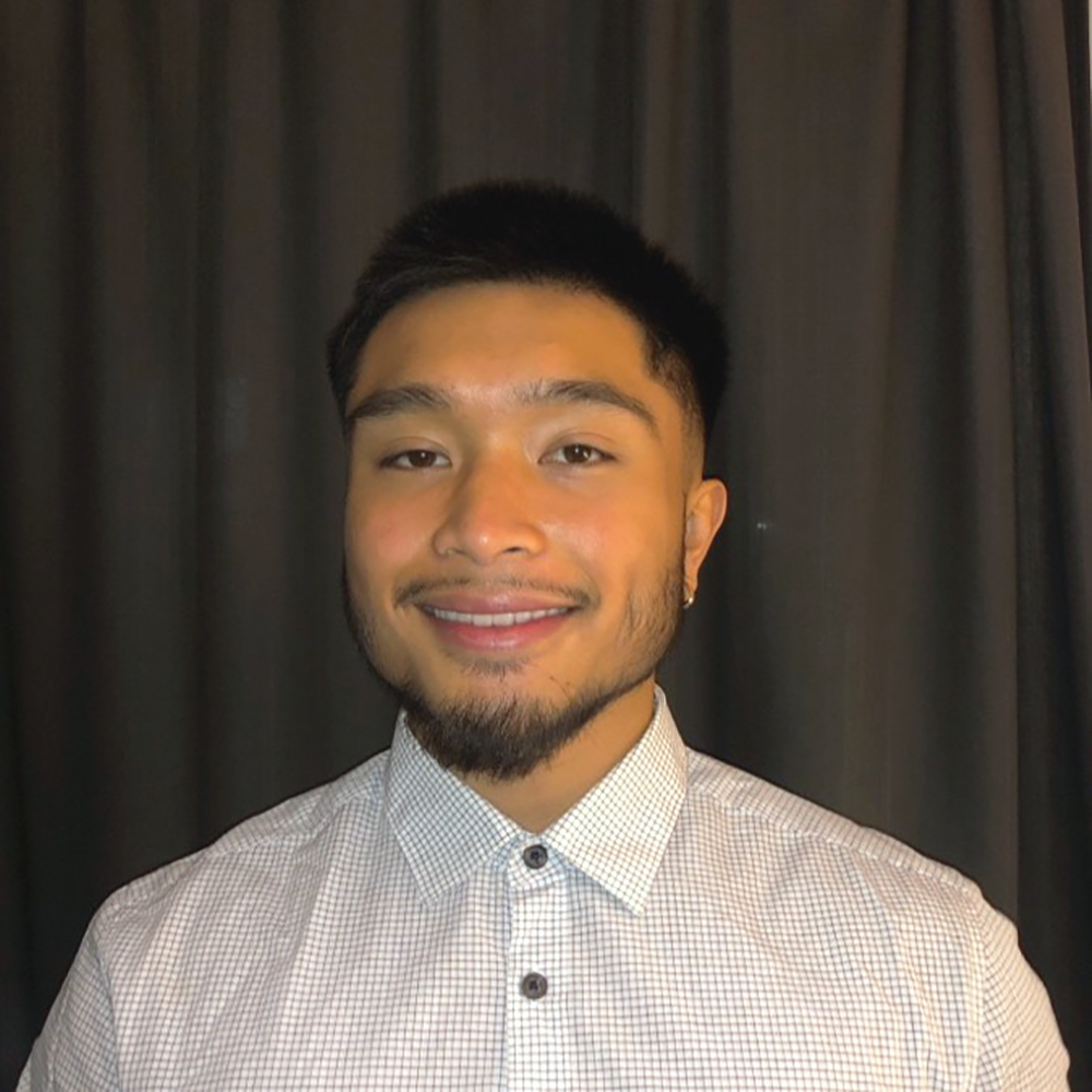 Picture of John Nolasco, wearing a white shirt