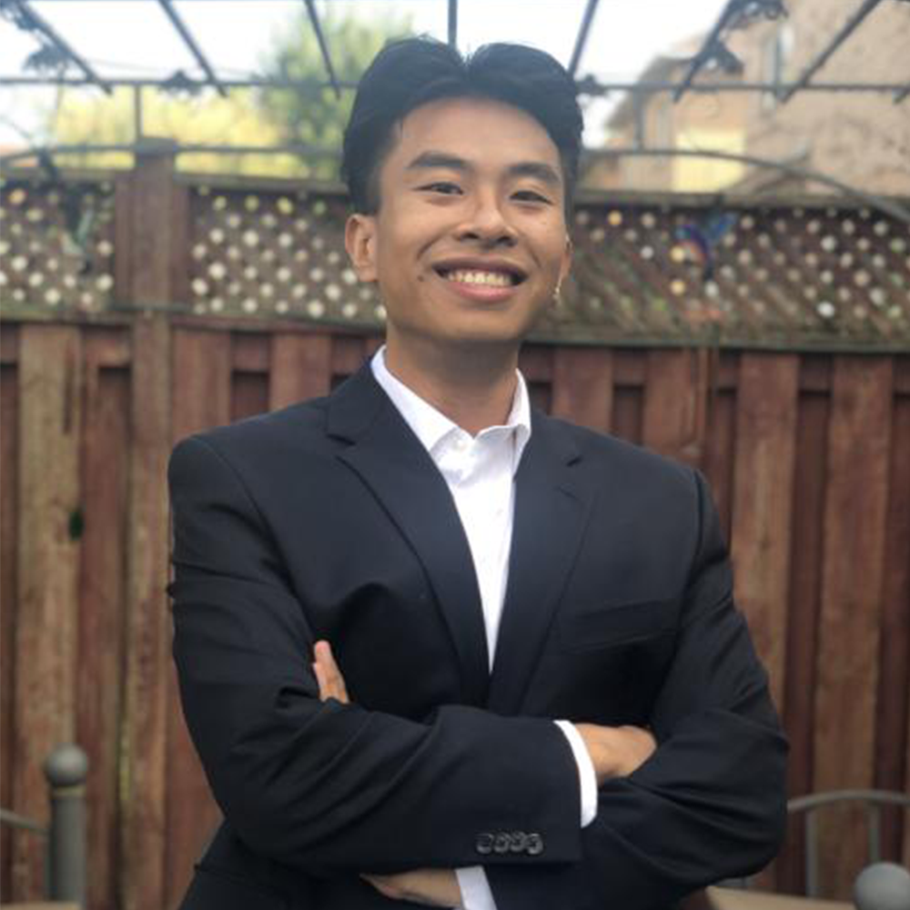Picture of Joseph, wearing a suit outdoors