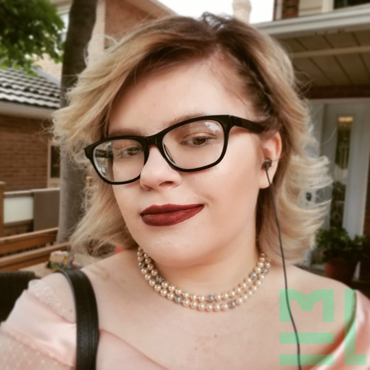 Madison, a light-skinned woman with bleached blonde hair and black sunglasses. She is pictured from the shoulders up.