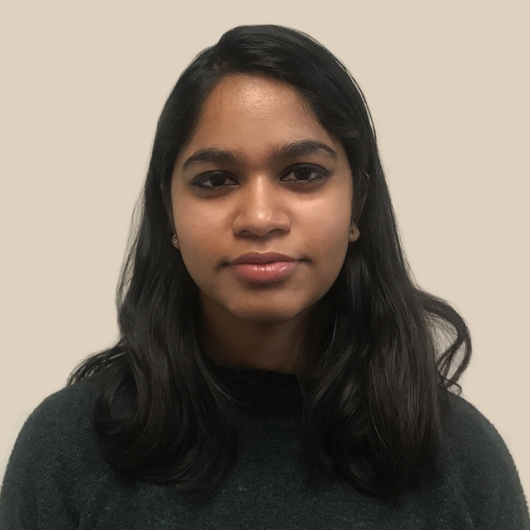 A picture of Thrinayana smiling slightly at the camera