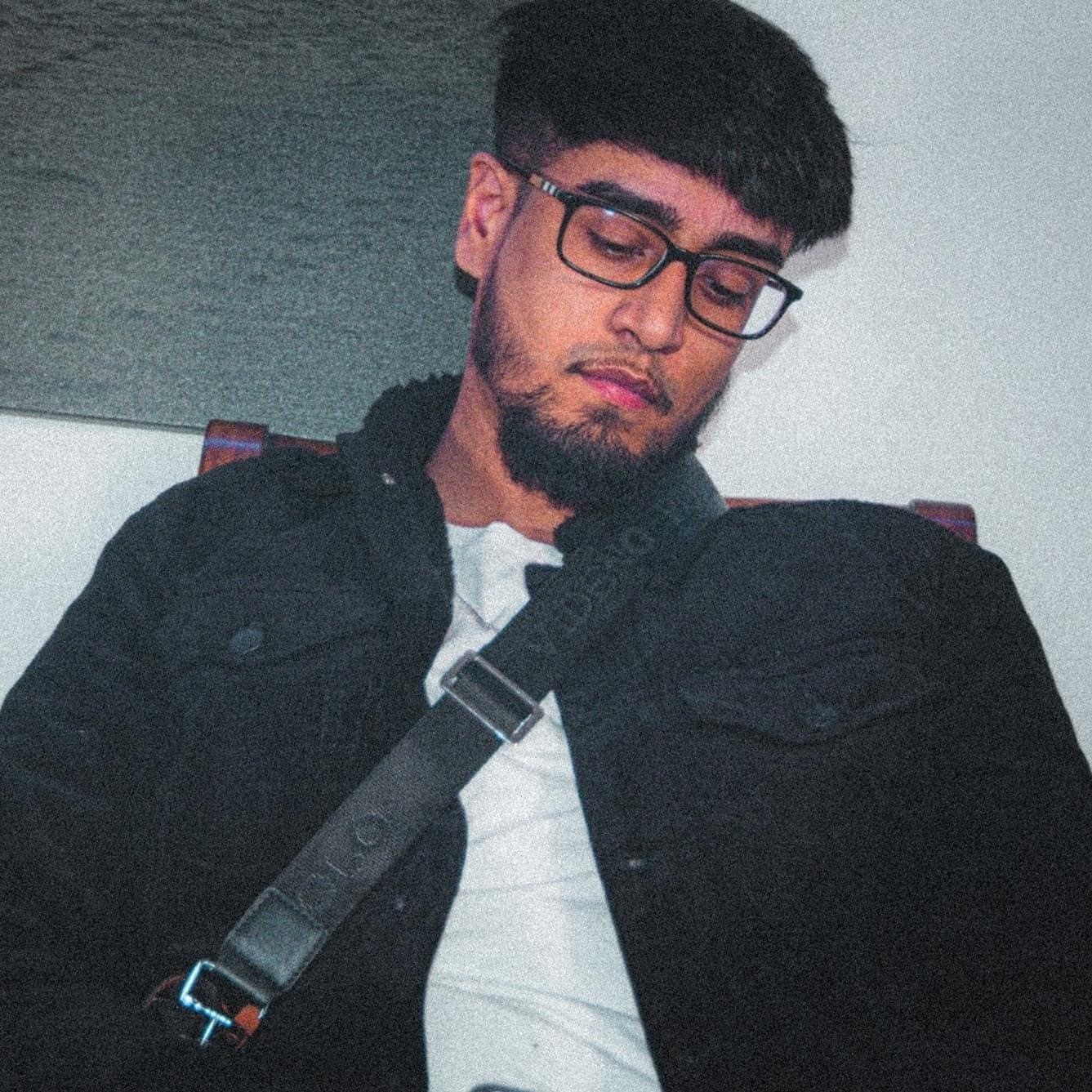 Picture of Mankirt, wearing a white shirt and a black jacket.