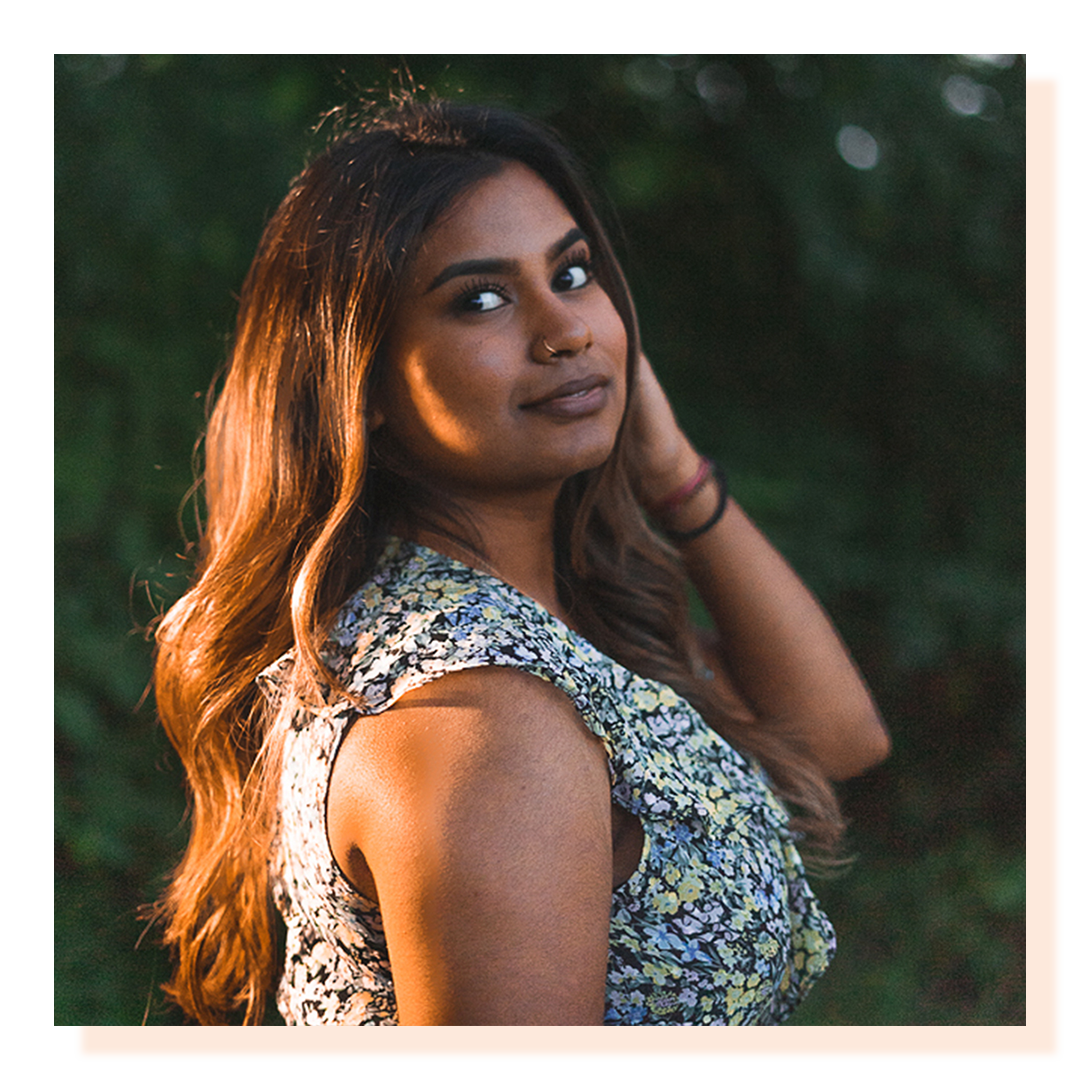 A side profile of a woman with golden sunlight on her hair.