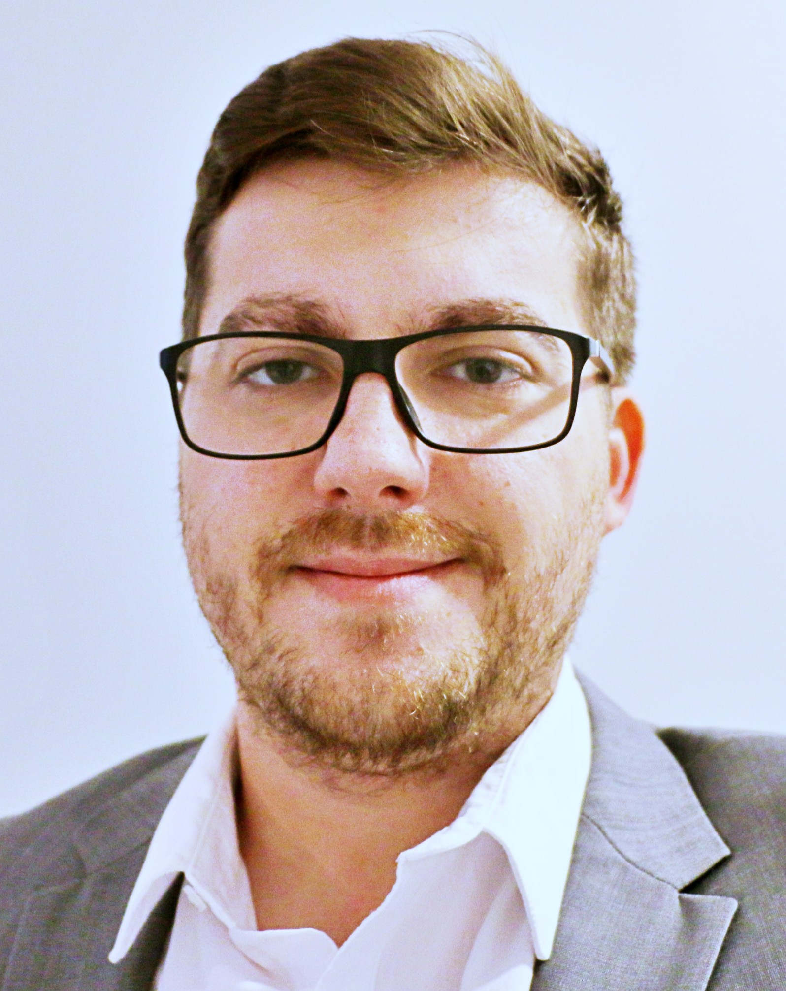 Person in glasses smiling