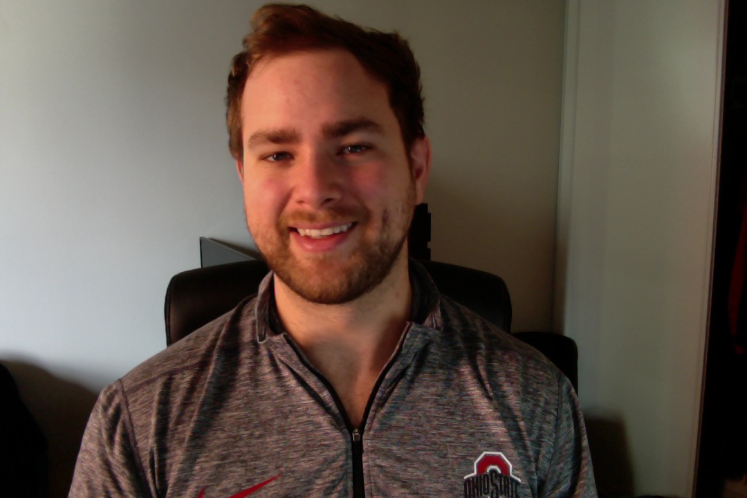 Picture of a man wearing a shirt from the sports team The Ohio State Buckeyes.
