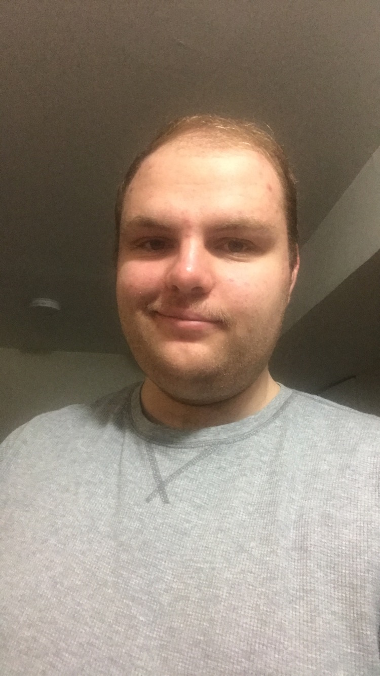 Man in white shirt smiling