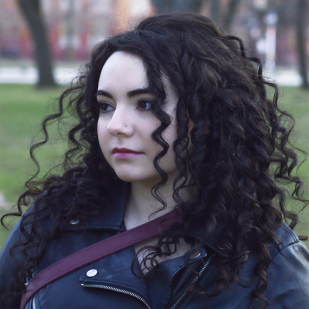 Headshot of Charlotte outside.