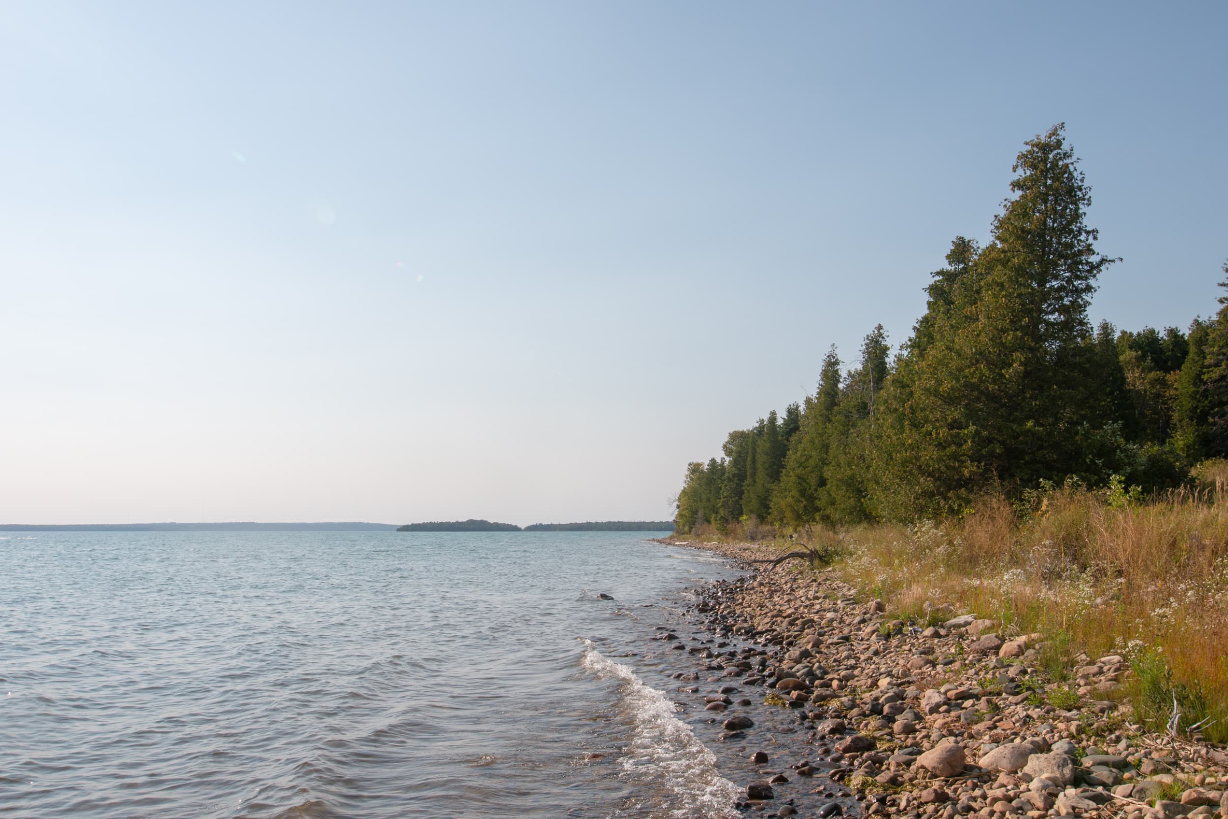 A rocky shoreline on a sunny day