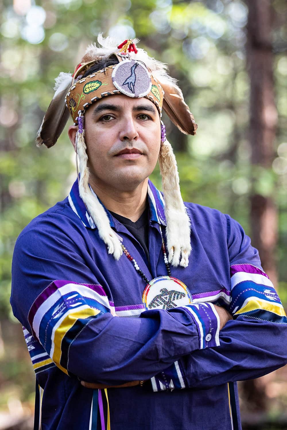 Reg Niganobe stands with arms crossed