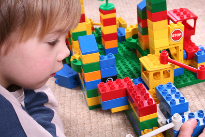 boy playing with legos