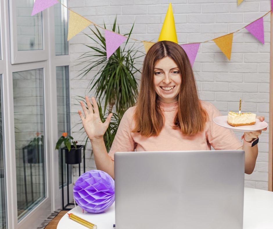Woman celebrating birthday watching video