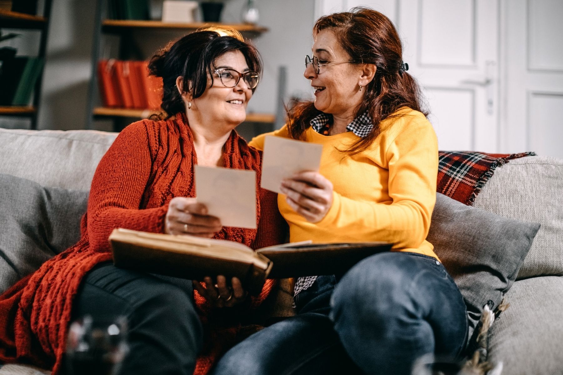 two women looking at photos