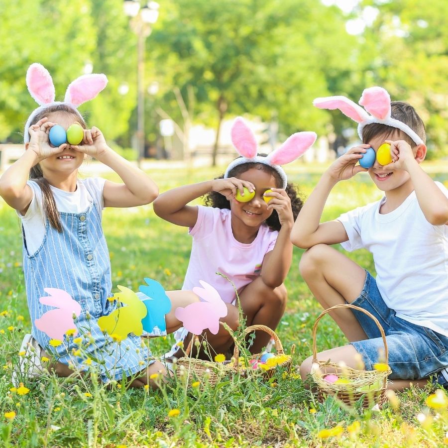 3 children playing with easter eggs