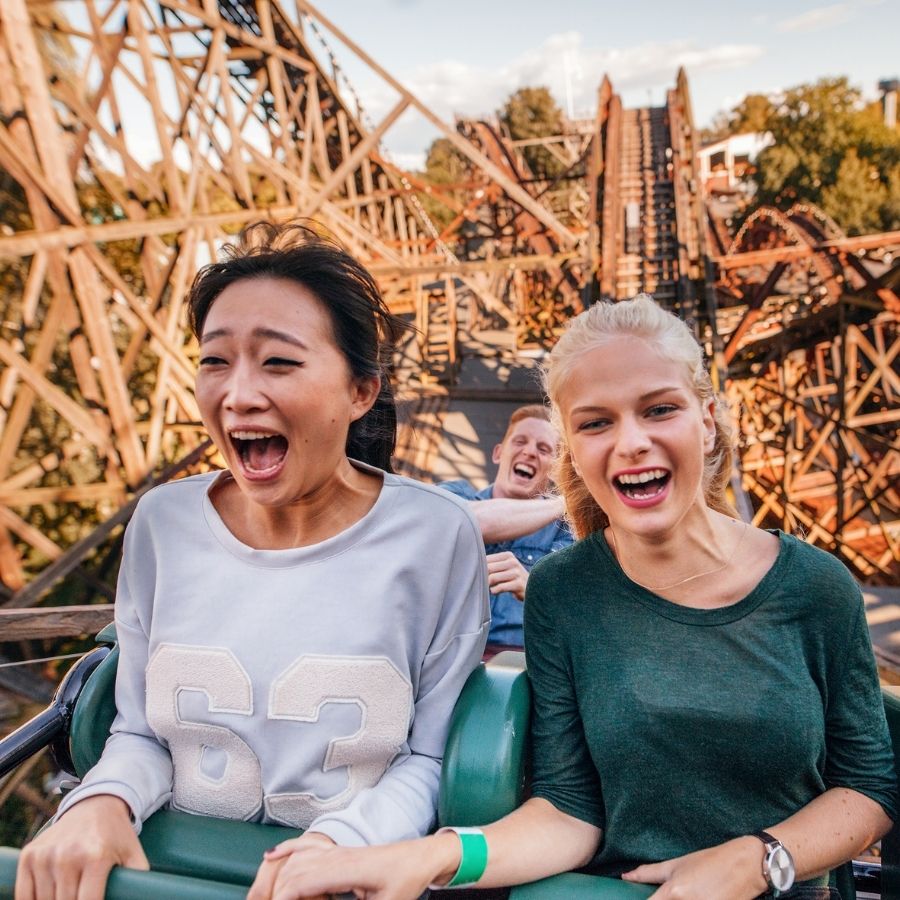Two women on roller coaster.