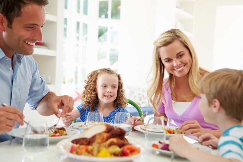 Family Eating Meal At Home Together