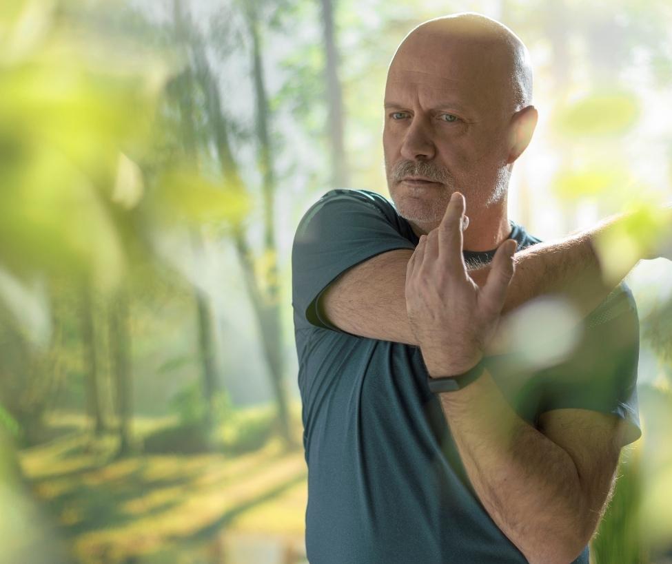 Older man stretching before exercise