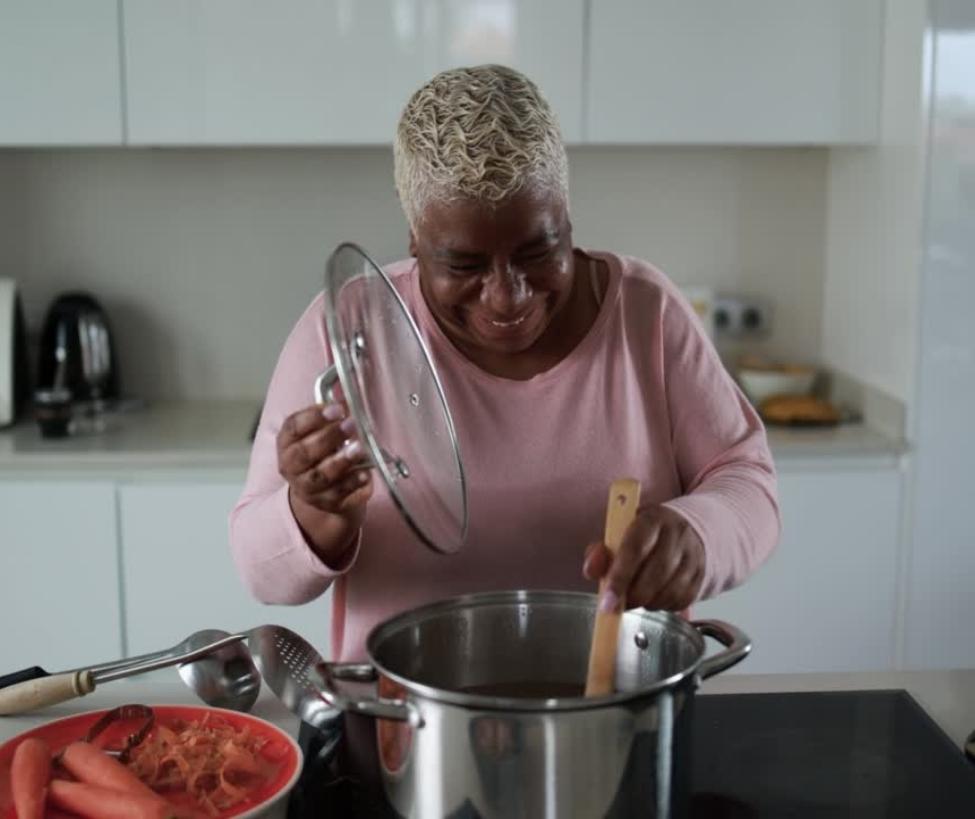 Older woman cooking a healthy meal
