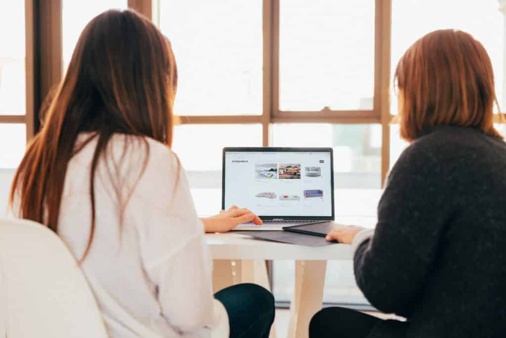 two women browsing for the best slack alternative