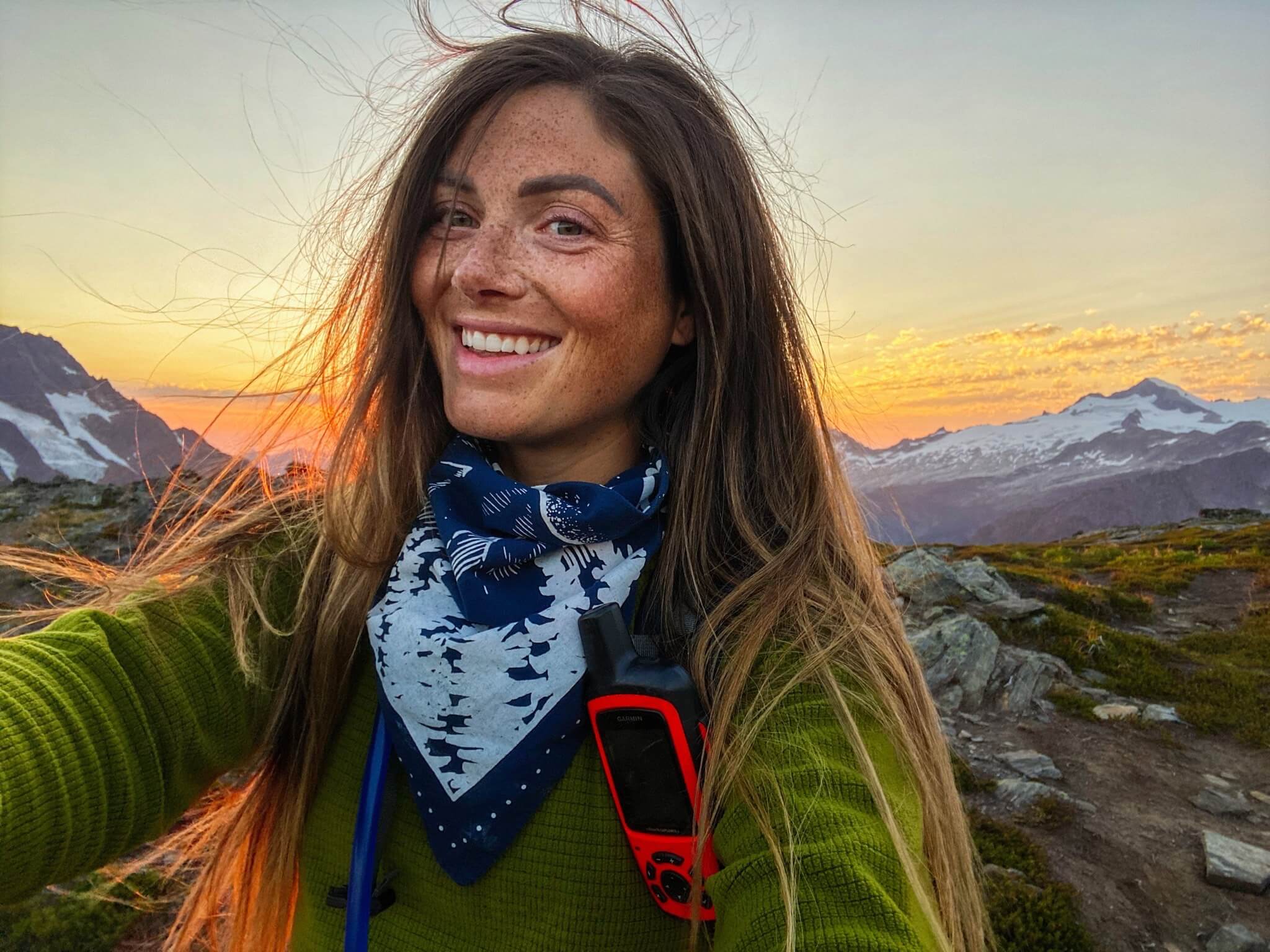 Woman smiling on mountain top