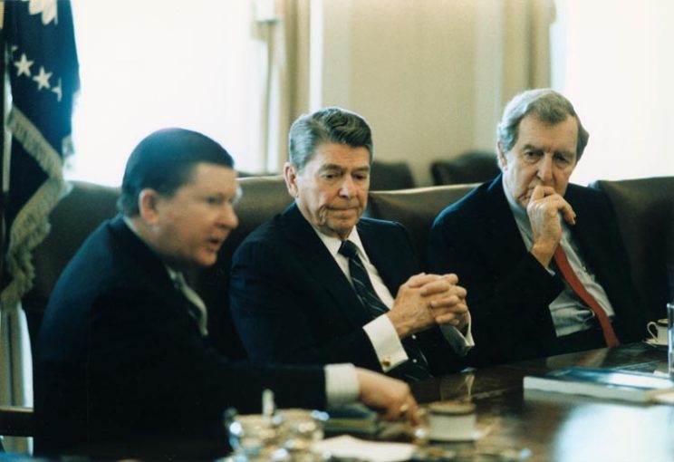 President Reagan receiving the tower commission report in the Cabinet Room, 1987 via Wikipedia.