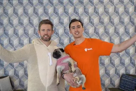 Founders of Spot Dog Walkers holding a pug